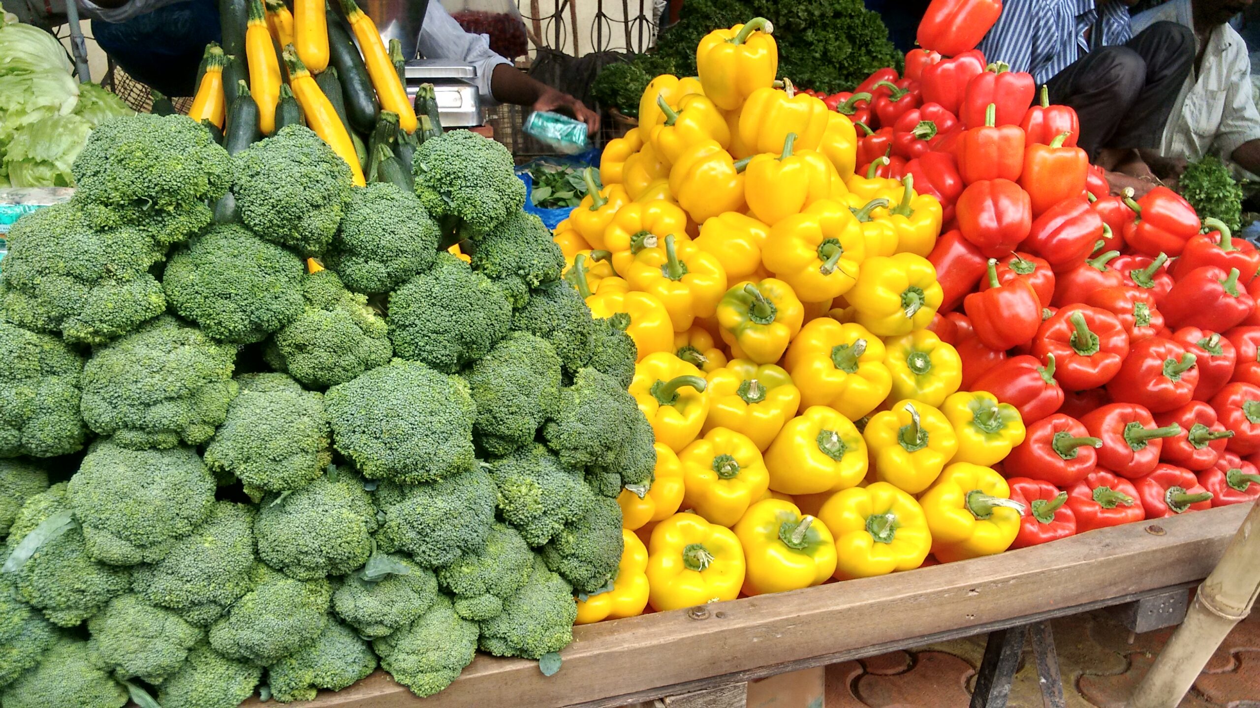 Colourful fresh vegetables at a Mumbai market — capsicum, broccoli and mixed produce