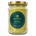 Fyonli Moringa pure leaf powder in a glass jar with gold lid, front view on white background