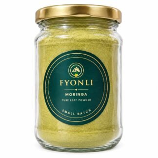Fyonli Moringa pure leaf powder in a glass jar with gold lid, front view on white background